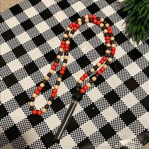 Hand assembled beaded necklace silk tassel